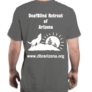 The background is Dark Grey with a white silhouette of the logo. In the background, the sun is seen at the horizon with rays. In front of the sun, is a large rock the has two cacti on the right and a coyote on the left howling towards the sky. DeafBlind of Retreat is spelled out at the top of the logo. www.dbrarizona.org is spelled out at the bottom of the logo.