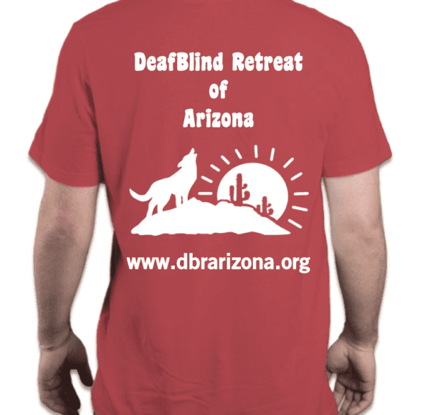 The background is Solid Red with a white silhouette of the logo. In the background, the sun is seen at the horizon with rays. In front of the sun, is a large rock the has two cacti on the right and a coyote on the left howling towards the sky. DeafBlind of Retreat is spelled out at the top of the logo. www.dbrarizona.org is spelled out at the bottom of the logo.